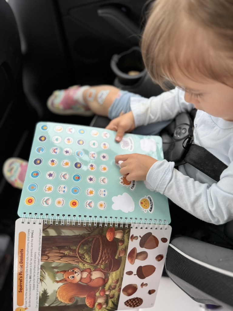 Baby with sticker reward pages